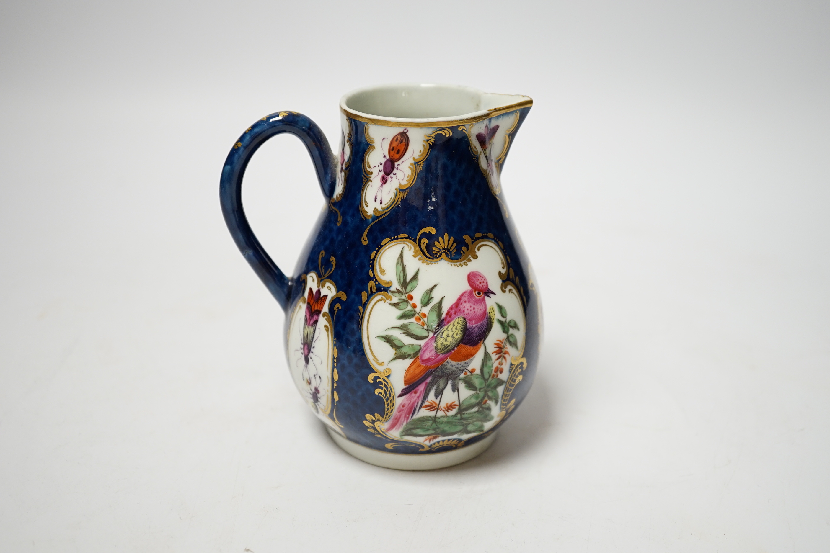 An 18th century Worcester blue scale jug, 11cm
